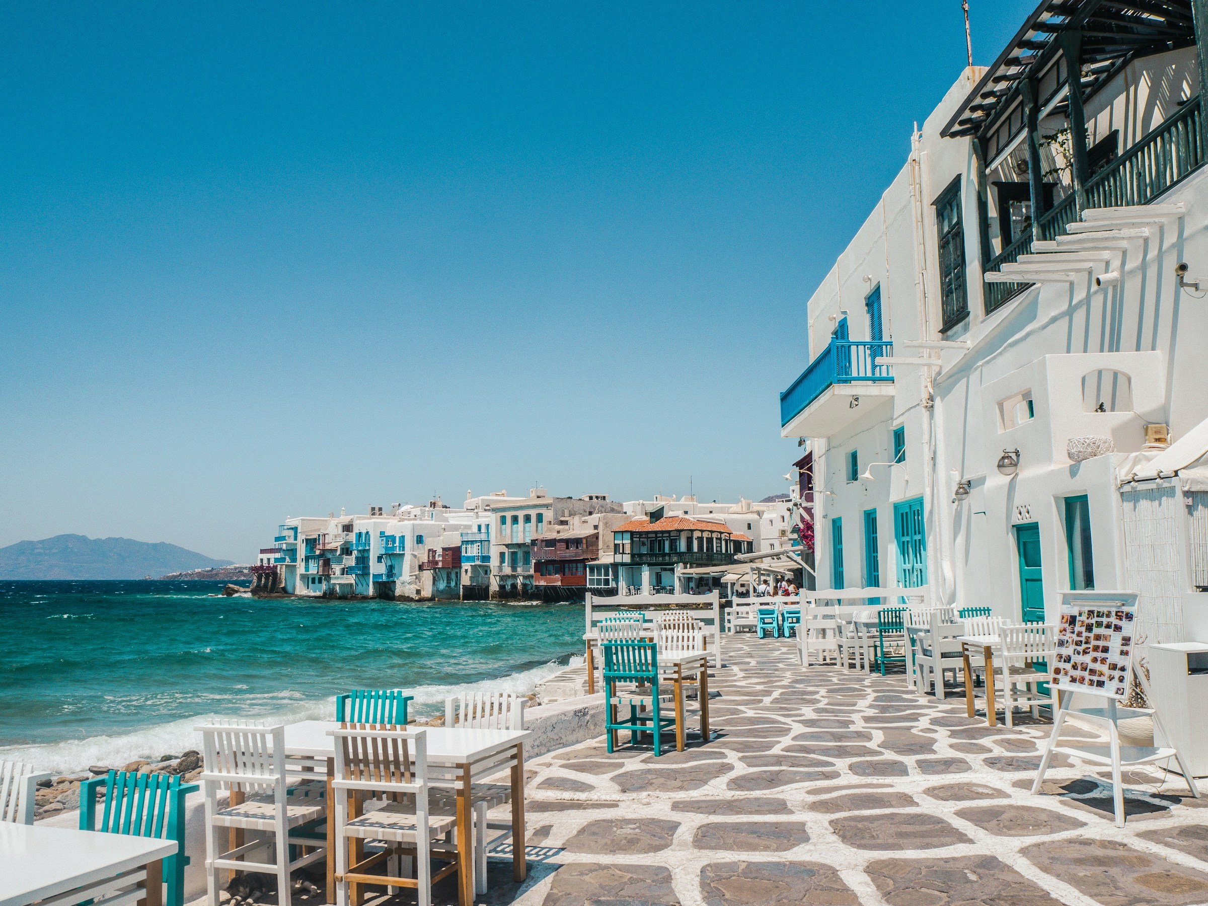 Santorini at blue hour, white architecture above the Aegean