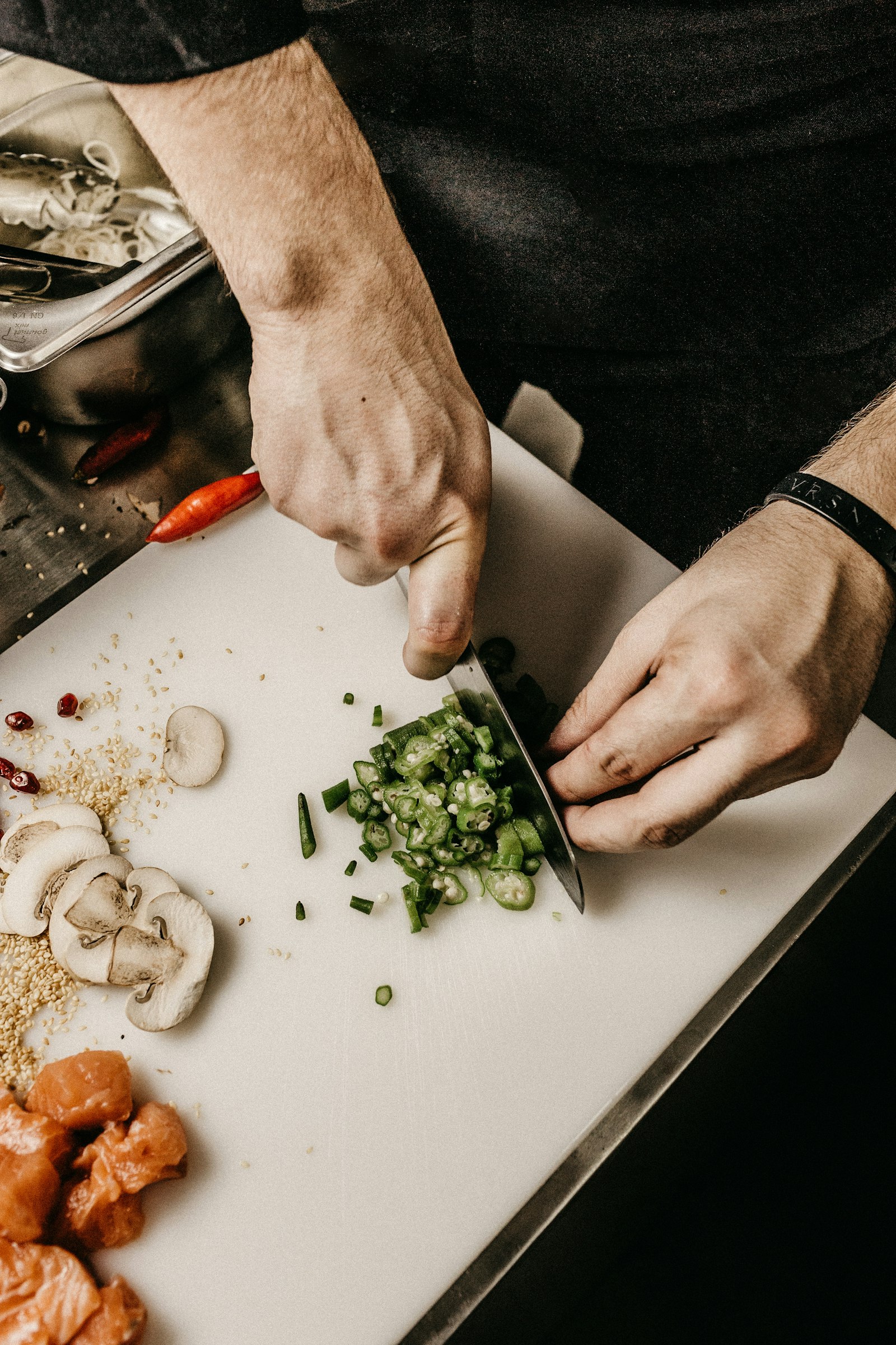 Chef's hands at work, editorial kitchen scene