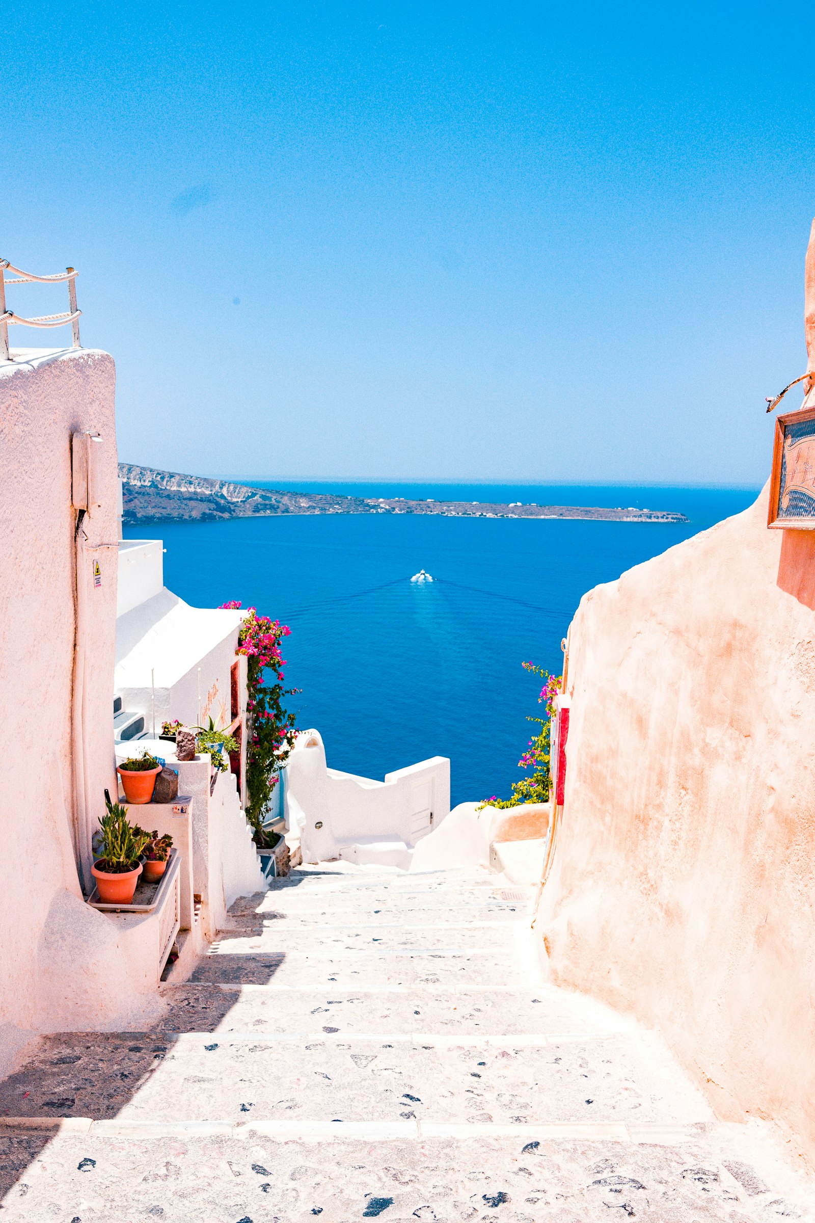 White Cycladic steps descending to the sea